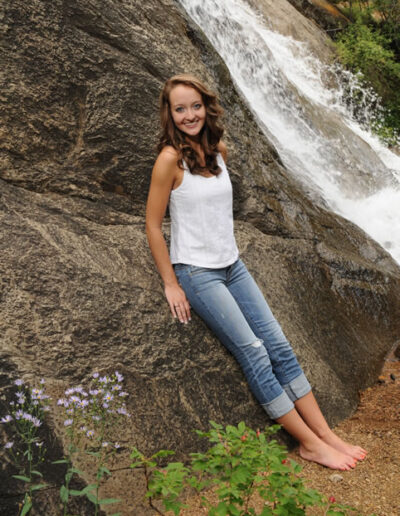 senior photo next to waterfall