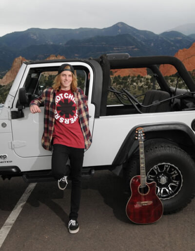 senior with jeep and guitar