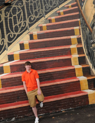 young man by stair artwork