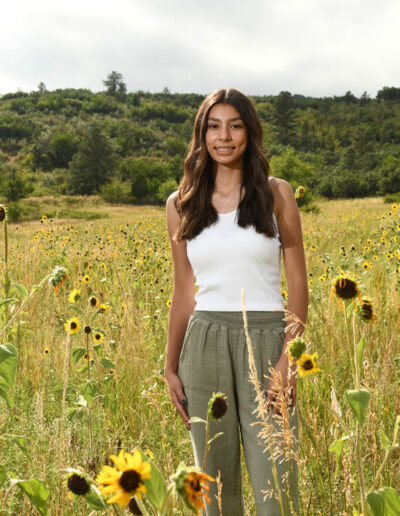 senior photo of girl in sunflowers