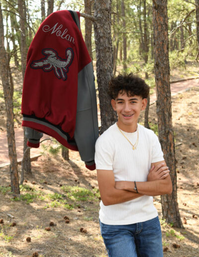 senior photo with letterman jacket