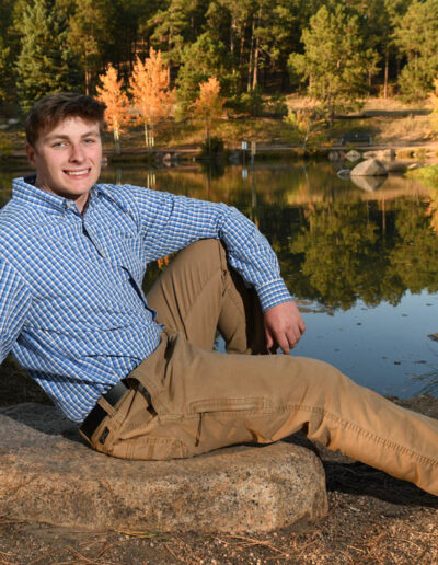 senior photo with lake in background