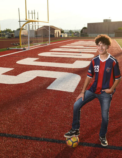 senior photos of boy with soccer ball