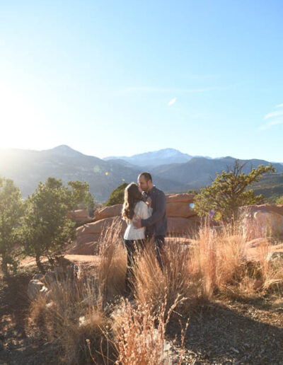 kissing with mountains in back