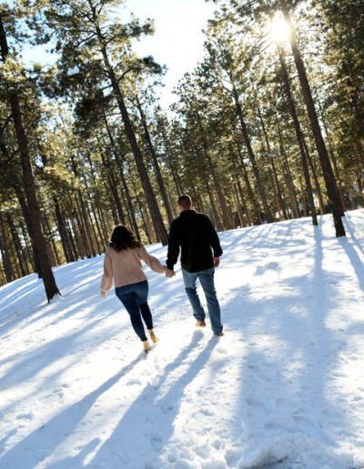 engagement photos walking in snow