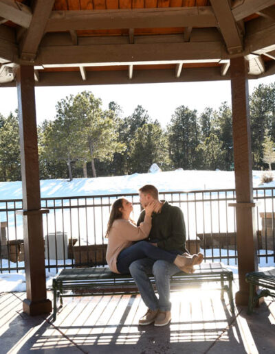 engagement photos sitting on bench