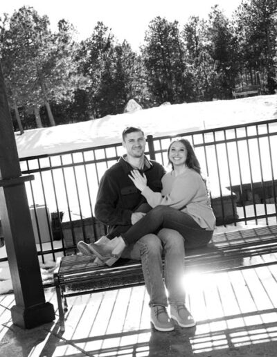 engagement photos sitting on bench