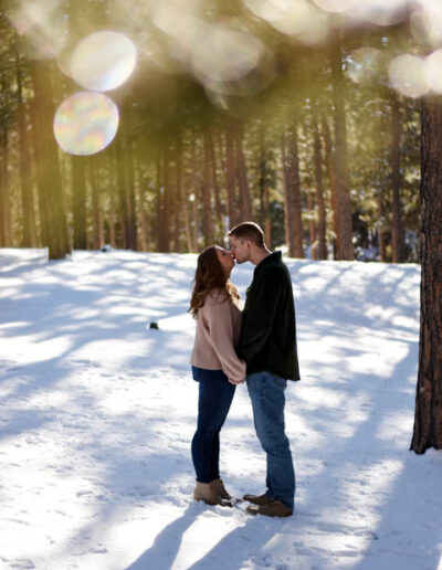 engagement photos kissing in the snow