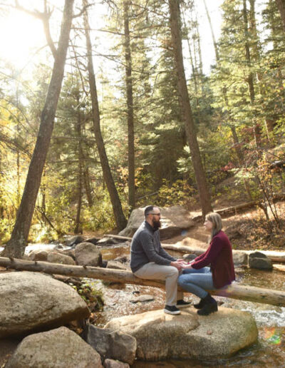 engagement photos - couple on a tree in creek